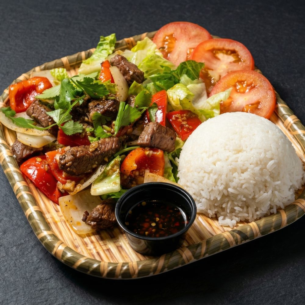 Cơm Bò Lúc Lắc — shaking beef with tomato, lettuce, and rice